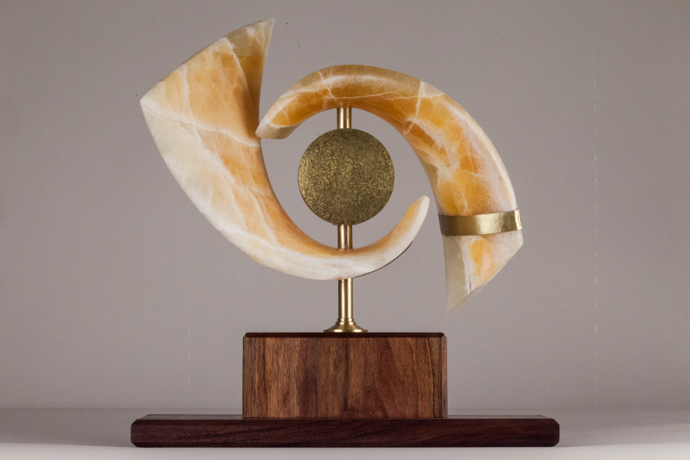 CAT’S EYE NEBULA, 22” X 21” X 8”, Utah honeycomb calcite with walnut & brass base