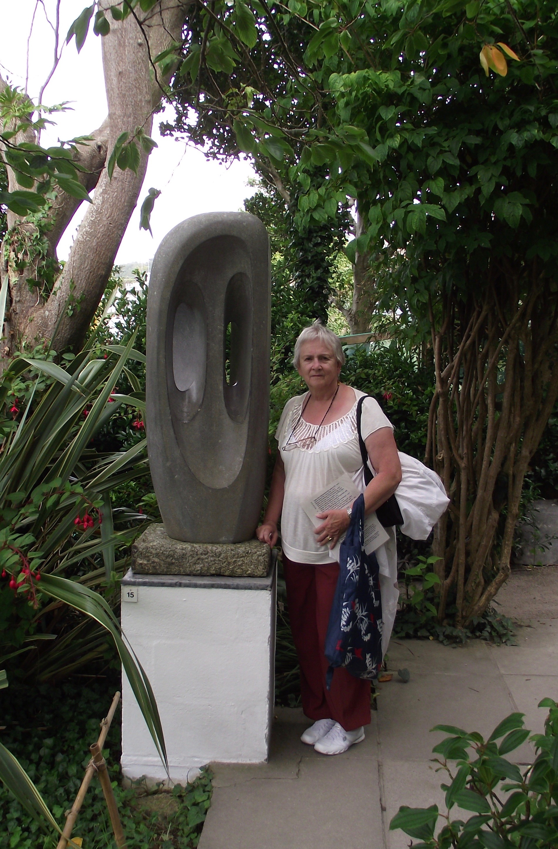 Arliss with a Hepworth sculpture in the garden of Trewyn studio. 