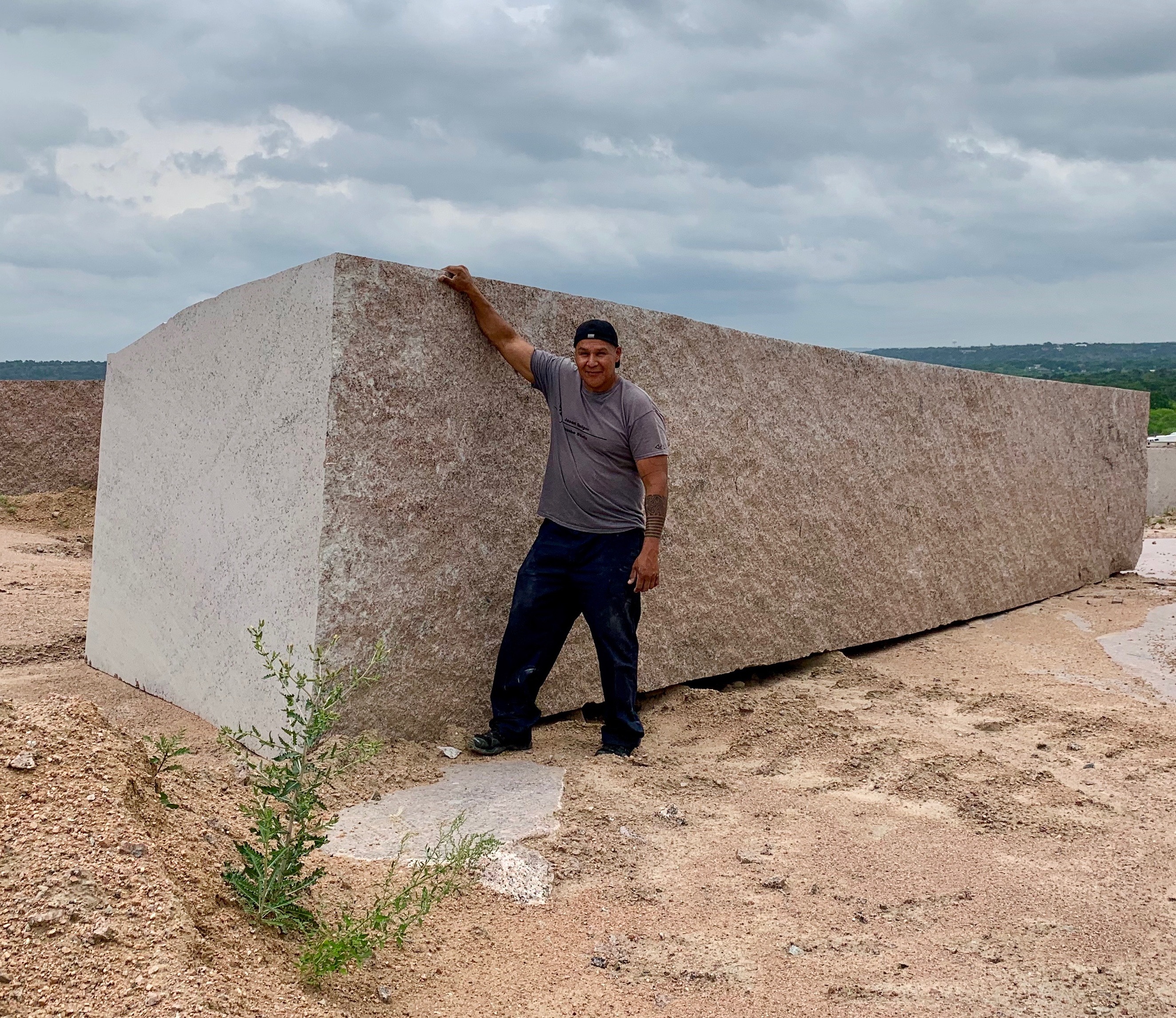 Jason Quigno immediately had to figure out how to take this quarry block home, or at least have his photo taken with it
