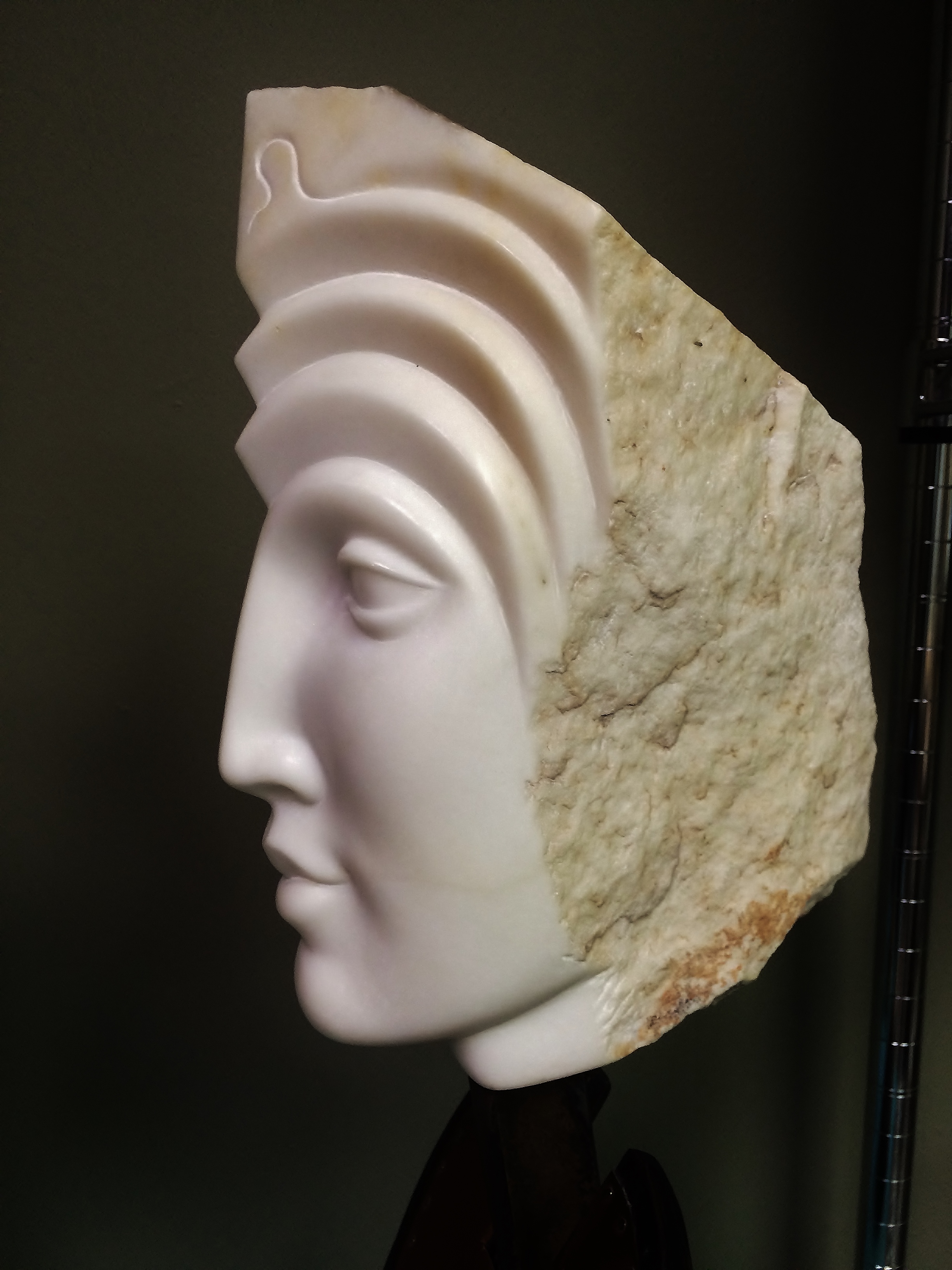 “Ancient woman”, Carrara marble on steel and wood base, 20” high. 