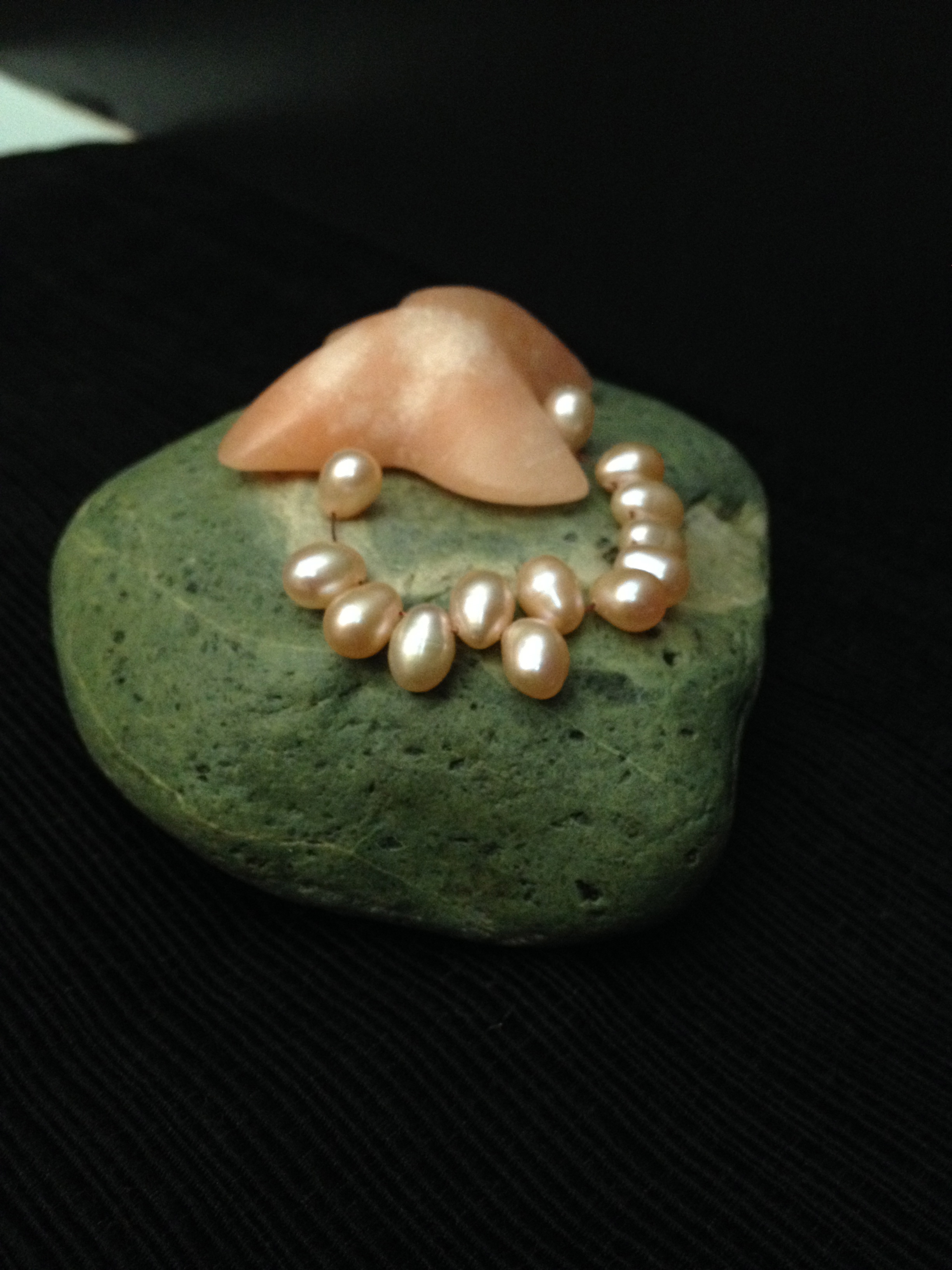 Patty McPhee “Tide Pool's Gift”,3” X 4” X 2”, beach stone, alabaster and pearl