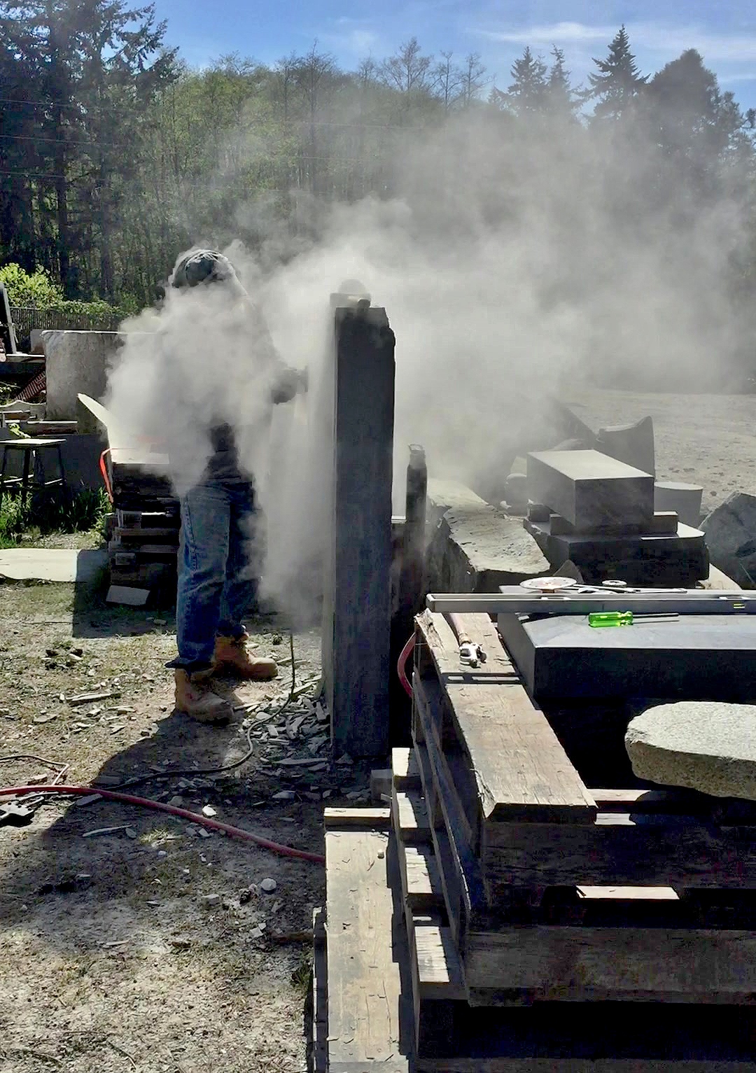 Woody cutting a slot in the bluestone for the water weir.