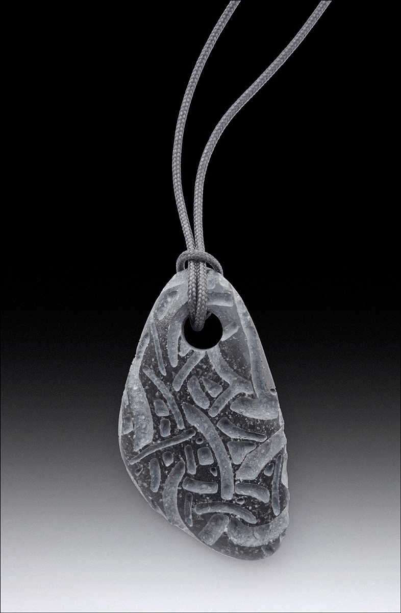 Beach pebble pendants, basalt, each about 2” long. 