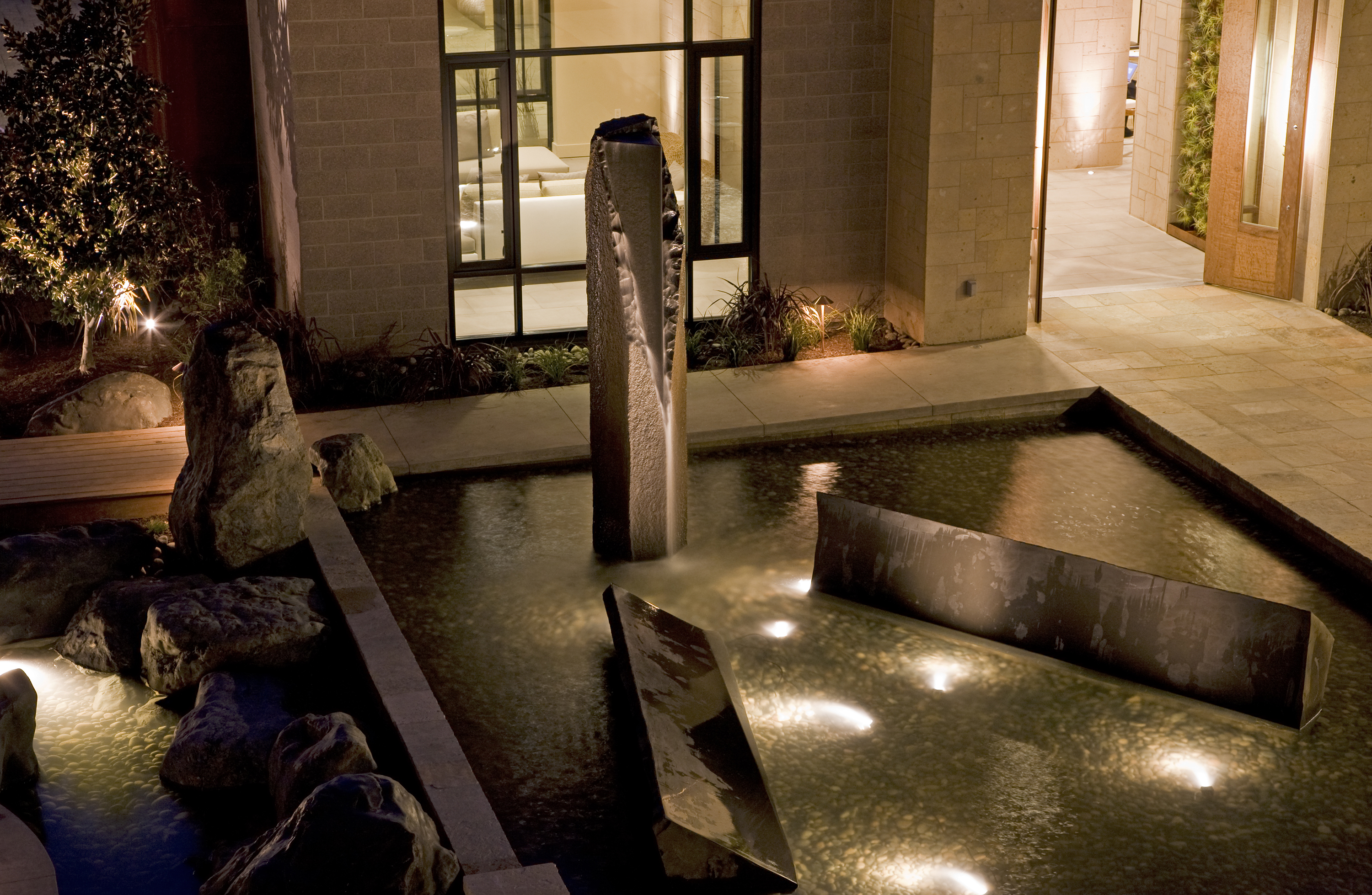 This fountain is near the entrance of the restaurant in the Bardessono Hotel. Rich designed and created all the features within this pool