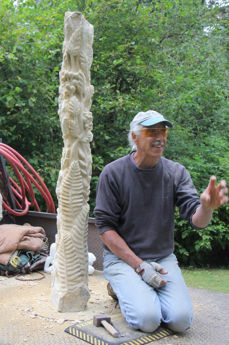 Mark Andrew works his magic on a limestone Kansas fencepost 